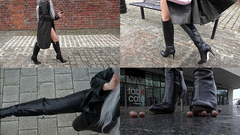 girls wearing a long leather coat, black leather boots, and leather gloves
